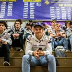 Lake Stevens quarterback Tre Long (center) smiles as the team watches a highlight video during the pep rally send-off for the football team Friday in Lake Stevens. (Olivia Vanni / The Herald)