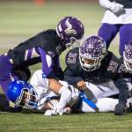 Lake Stevens Devin MacWatters (left), Junior Robinson (center) and Kasen Kinchen (right) tackle a Graham-Kapowsin player during the Nov. 9 game in Lake Stevens. (Olivia Vanni / The Herald)