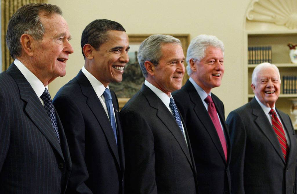 President George W. Bush (center) poses with President-elect Barack Obama, (second left) and former presidents, George H.W. Bush (left), Bill Clinton (second right) and Jimmy Carter (right) in the Oval Office of the White House in Washington in 2009. (J. Scott Applewhite / AP file)