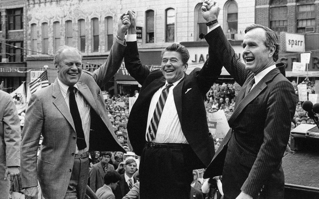 Former President Gerald Ford lends his support to Republican presidential candidate Ronald Reagan and his running mate, George H.W. Bush, in Peoria, Illinois, in 1980. Bush died at the age of 94 on Friday, Nov. 30, 2018, about eight months after the death of his wife, Barbara Bush. (AP Photo / file)