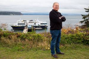 Matt Nichols, president of Nichols Brothers Boat Builders, stands above the National Geographic Venture docked at the companys private outfitting pier in Langley. The 240-foot cruise ship is the newest custom vessel built at the main Freeland shipyard. (Andy Bronson / The Herald)