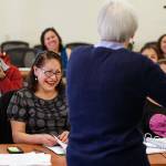 Nancy Amidei, with the University of Washington School of Social Work, gets a laugh from adult students Saturday, Nov. 17, during a class of the Parent Leadership Training Institute and the Childrens Leadership Institute in Everett. (Andy Bronson / The Herald)