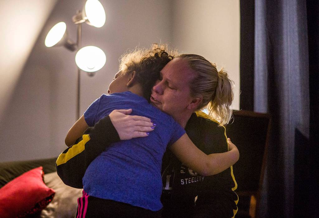 Kaya hugs her mom, Jasmine Kaiser, after seeing her become upset. (Olivia Vanni / The Herald)
