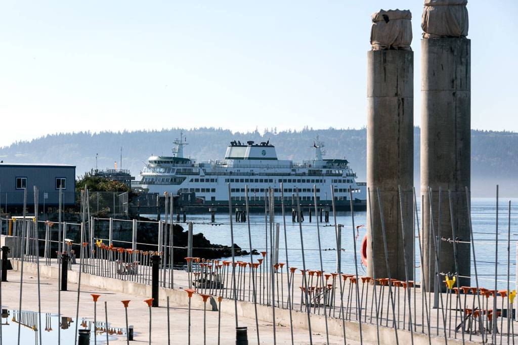 A ferry docks at the current ferry terminal Oct. 11, while part of the new terminal was under construction. (Kevin Clark / Herald file)