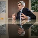 Surrounded by maps, Dan Eernissee, Everetts new Director of Economic Development, talks about the citys plans to strengthen its relationship with the Everett business community on Nov. 21 in Everett. (Andy Bronson / The Herald)