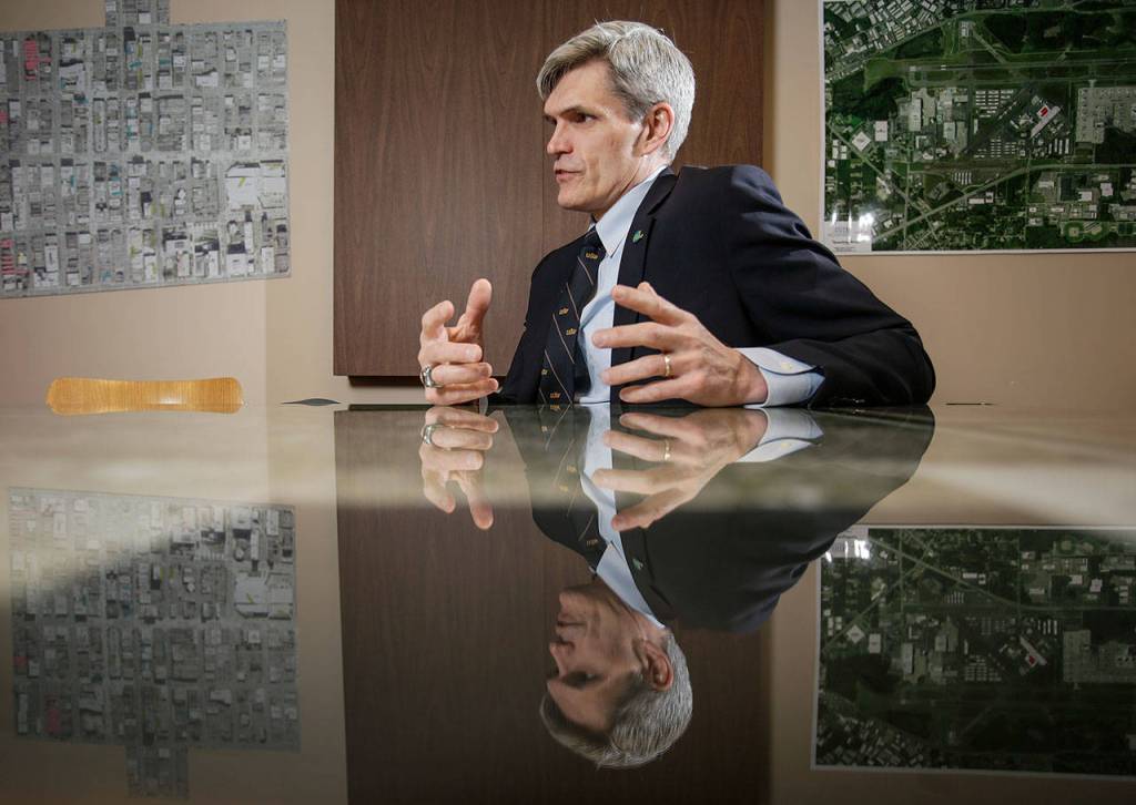 Surrounded by maps, Dan Eernissee, Everetts new Director of Economic Development, talks about the citys plans to strengthen its relationship with the Everett business community on Nov. 21 in Everett. (Andy Bronson / The Herald)