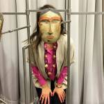 Susan Ringstad Emery spent several days at the Anchorage Museum studying artifacts from the Smithsonian Arctic Studies Center. Here, however, she is caught looking through an amazing mask.