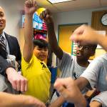 Horizon Elementary School Principal Edmund Wong bumps fists with with students in the Wednesday Boys Club program at the end of the session on Wednesday, Dec. 5, 2018 in Everett, Wa. (Andy Bronson / The Herald)