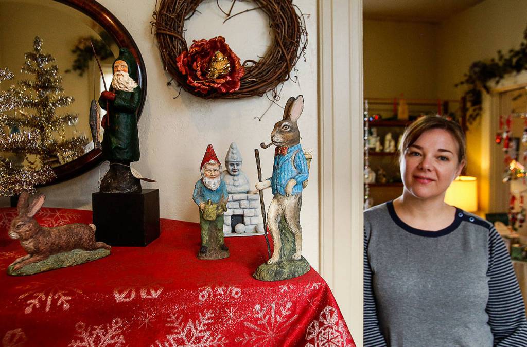 The papier-mache figures here were made by Katherine Webber, youngest sibling of the late Elizabeth Webber. Lovena Laycock helps owner Mary Elmore at Christmas Gifts on Broadway. (Dan Bates / The Herald)