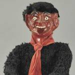 Devilish Krampus figure holds a basket of naughty children