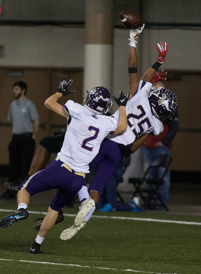 Lake Stevens Kasen Kinchen (25) gets a hand on the ball but is called for pass interference during the 4A state football championship game against Union on Dec. 1, 2018, at the Tacoma Dome. (Andy Bronson / The Herald)