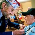 For his contribution to Allied efforts to liberate France during WW II, Peter Bellecy, 96, <a href="https://www.heraldnet.com/news/a-medal-and-a-thanks-74-years-after-allies-liberated-france/" target="_blank">receives the French Legion of Honor medal</a> Nov. 14. Presenting the medal and pinning it to Bellecys shirt is Donald Wischmann, quartermaster of Veterans of Foreign Wars Post 2100 in Everett. (Dan Bates / The Herald)