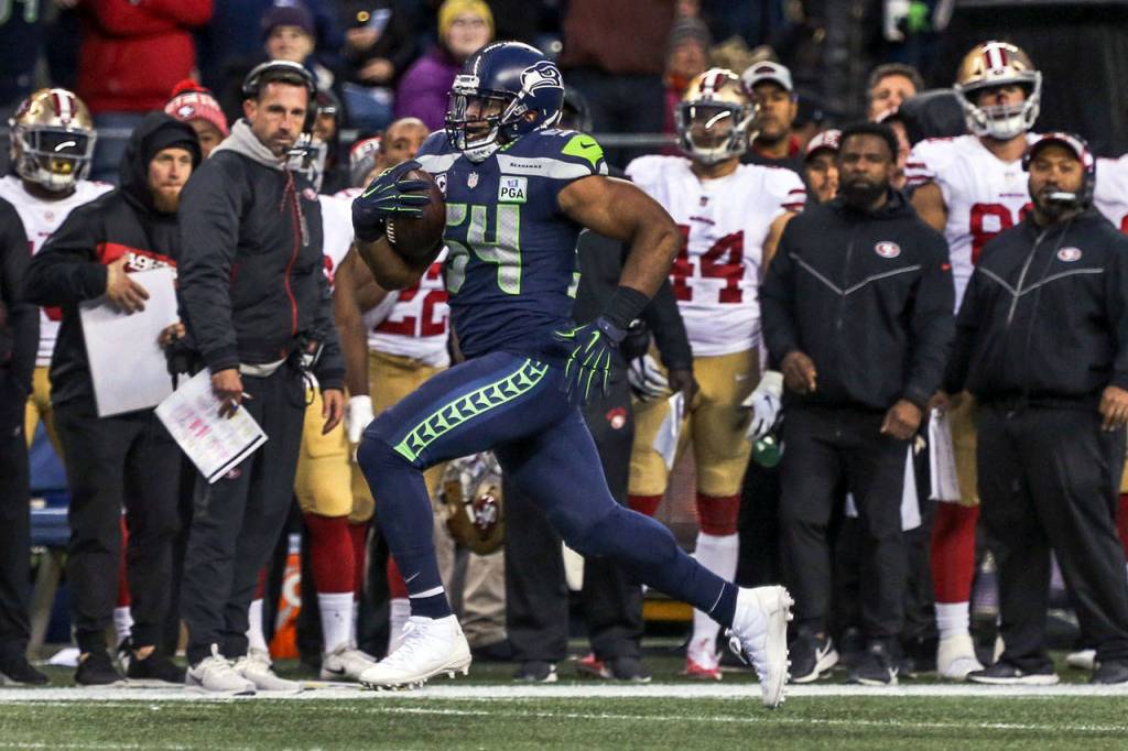 Seahawks linebacker Bobby Wagner returns a 98-yd interception for a touchdown Sunday afternoon at CenturyLink Field in Seattle on December 2, 2018. Seahawks won 46-16. (Kevin Clark / The Herald)