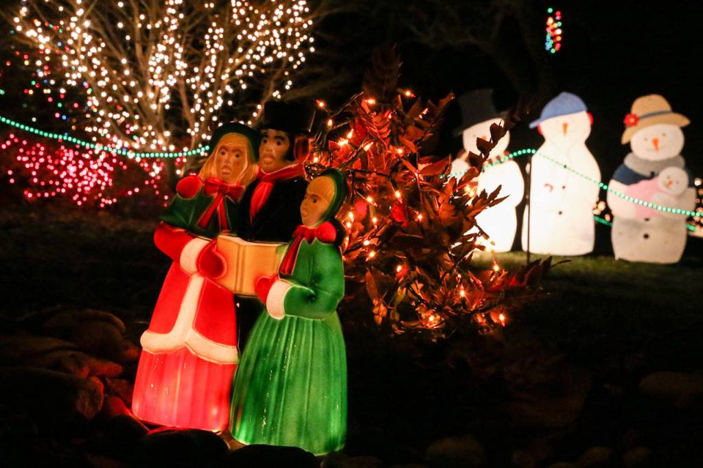 Jerry Beck and his family decorate their Clinton home with more than 30,000 lights and handmade decorations every year and keep it open for the public is view. About 1,400 people come see it every year. (Kevin Clark / The Herald)