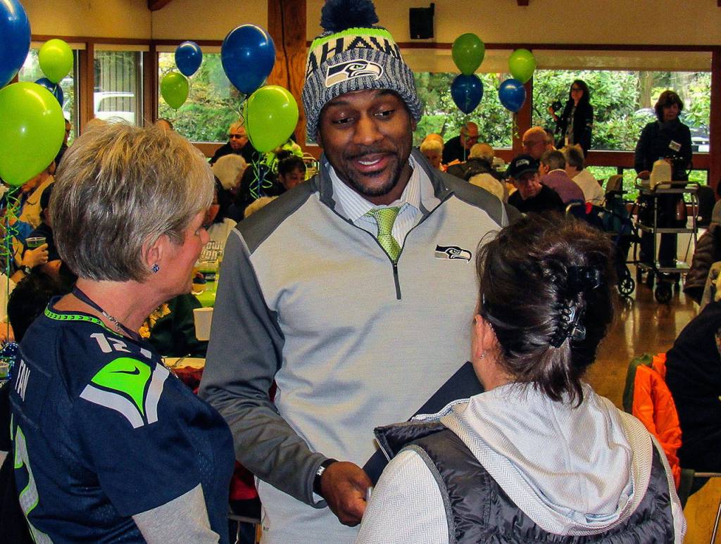 Former Seahawk Jordan Babineaux talks with fans at a 12 Days of Goodness event. (Contributed Photo)