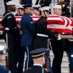 The flag-draped casket of former President George H.W. Bush is carried by a joint services military honor guard from the U.S. Capitol on Wednesday in Washington. (Shawn Thew/Pool Photo via AP)