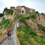 A footpath is all that connects Italys Civita di Bagnoregio to the mainland. (Rick Steves Europe)