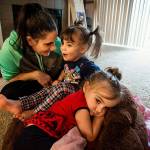 Twin sisters Emma (center) and Chloe Orick, 3, spend time with their mother, Sihaya Sweum, on Feb. 8. The twins were treated for heavy smoke inhalation following a fire at their apartment on Jan. 29. Two members of the Everett Fire Department were honored with a Red Cross Fire Rescue Award for saving the girls. (Ian Terry / Herald File)