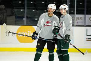 Free agent and former Anaheim Ducks NHL defenseman Kevin Bieksa, left, gives Everett Silvertips Gabe Goncalves advice during practice at the Angel of the Winds Arena on Thursday, Dec. 6, 2018 in Everett, Wa. Bikes was practicing with the Tips to get ready to play for the Canadian National Team. (Andy Bronson / The Herald)
