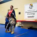 At the Don Hatch Youth Center, Verle Smith starts to tear up while friends and family congratulate him as the first graduate from the Tulalip Healing to Wellness Court, on Monday, Dec. 10, 2018 in Tulalip Reservation, Wa. His daughter Melody, 5, hides under a blanket, presented to him for graduating the program. (Andy Bronson / The Herald)