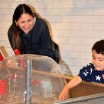 A family plays together at Imagine Childrens Museum in October during a free program for families with children who are on the autism spectrum or who have sensory disorders. (Imagine Childrens Museum)
