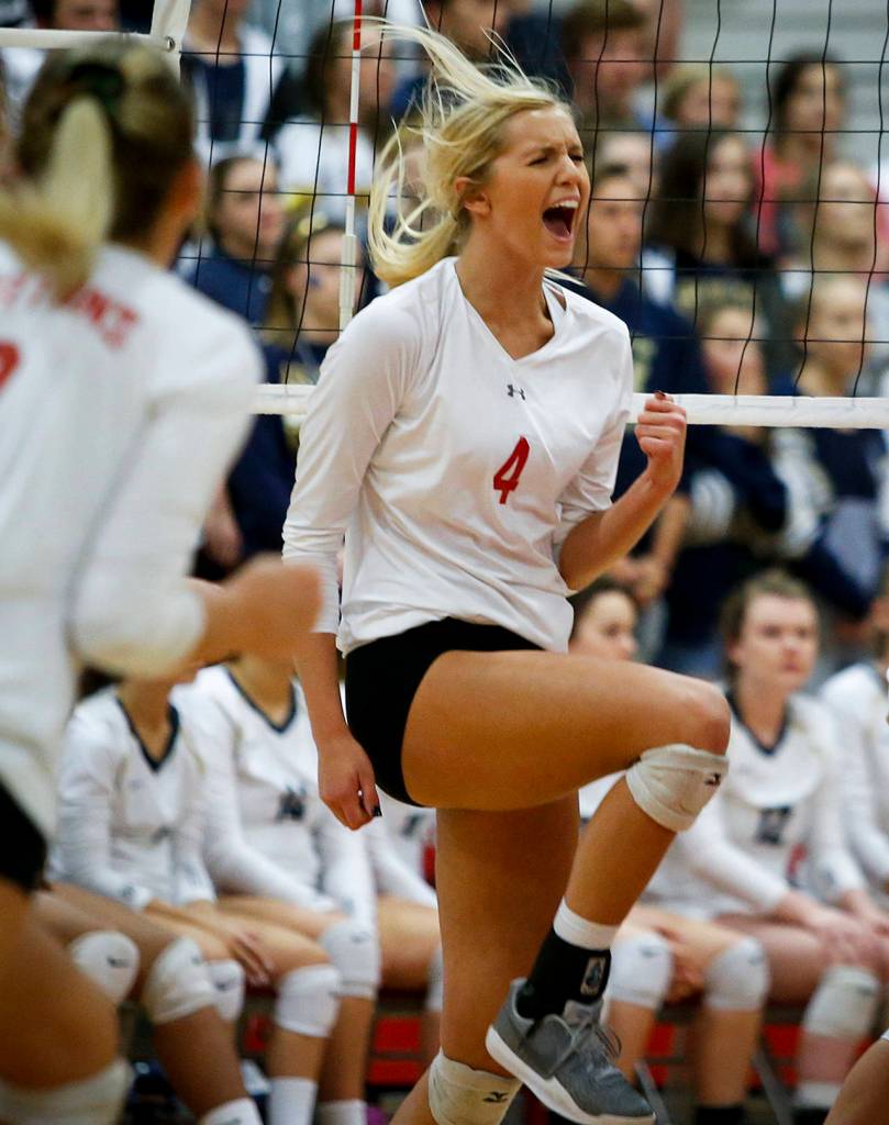 Stanwoods Devon Martinka celebrates a point during a game Oct. 17, 2017, against Arlington at Stanwood High School. (Ian Terry / The Herald)