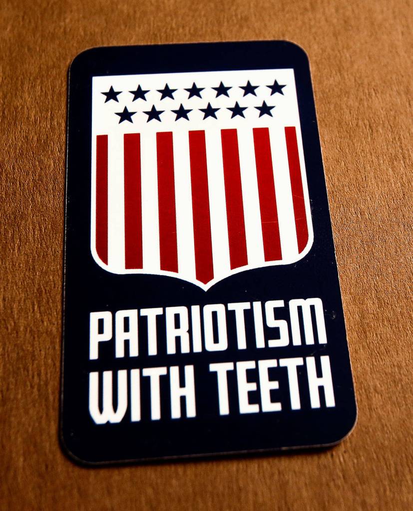 The back of a card mailed to Herald writer Julie Muhlsteins home from the white-supremacist organization Patriot Front says Patriotism With Teeth. (Dan Bates / The Herald)