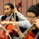 Betty Gebretsadik (left) plays the cello during a recording session at Edmonds Community College. (Kevin Clark / The Herald)