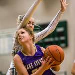 Lake Stevens Cori Wilcox tries to get around Jacksons Lauren Schillberg during Tuesdays game in Mill Creek. (Olivia Vanni / The Herald)
