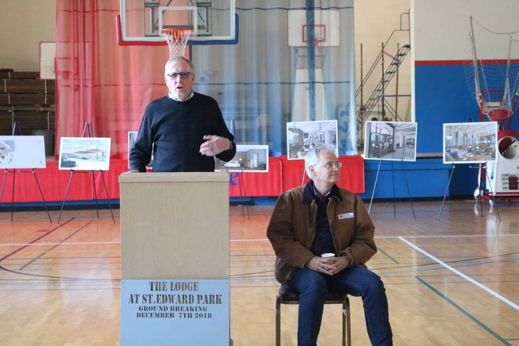 Ken Bounds and Kevin Daniels thank supporters of the Lodge at Saint Edward Park project on Dec. 7 in the gym next door to the seminary building. (Katie Metzger / Bothell-Kenmore Reporter)