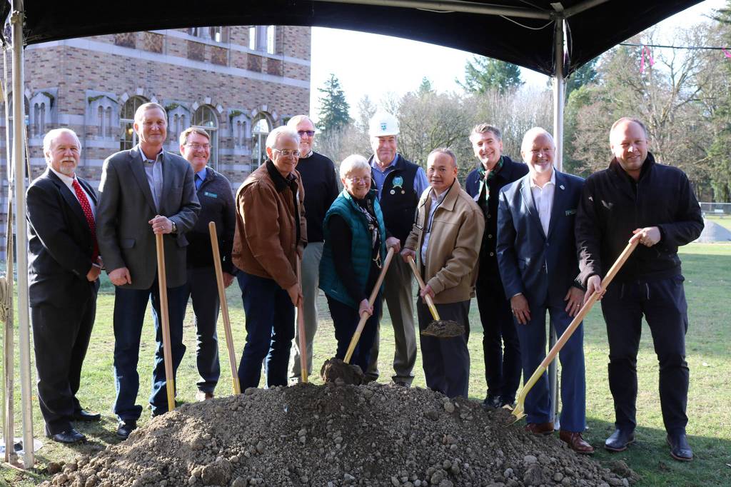 State legislators Jeff Holy and David Frockt pose with Kevin Daniels and Washington State Parks commissioners and staff at the ceremonial groundbreaking for the Lodge at Saint Edward Park on Dec. 7. (Katie Metzger / Bothell-Kenmore Reporter)