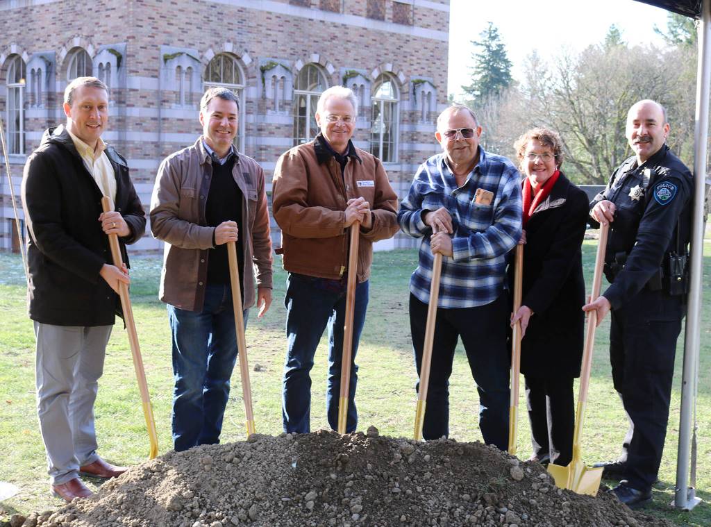 Kenmore city staff, including City Manager Rob Karlinsey, Assistant City Manager Nancy Ousley, Police Chief Peter Horvath, smile with Kevin Daniels and Mayor David Baker at the ceremonial groundbreaking for the Lodge at Saint Edward Park on Dec. 7. (Katie Metzger / Bothell-Kenmore Reporter)