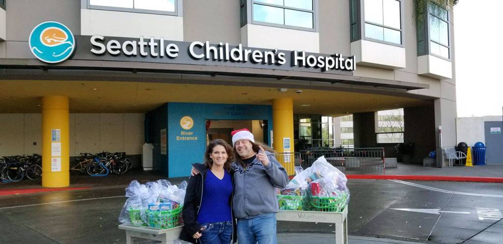 Wade Tucker and Lettia Burch deliver toys to the Seattle Childrens Hospital. A group of their friends put together more than 150 gift baskets. (Wade Tucker)