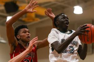Marysville Pilchucks RaeQuan Battle attempts to block Edmonds-Woodways Mutdung Bol from behind on Friday night at Edmonds-Woodway High School. Marysville Pilchuck won 55-53. (Kevin Clark / The Herald)
