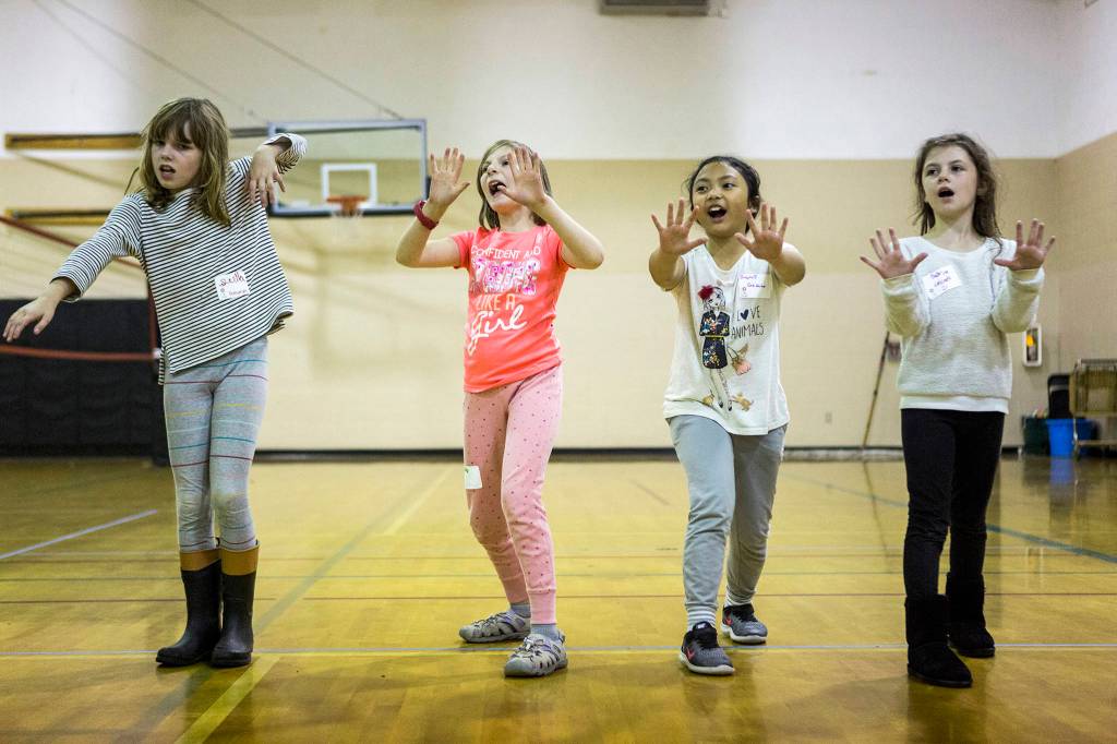 From left, Stella McClung, 9, Hailey Gaddis, 9, Irajoy Abrea, 9, and Sabrina Axtell, 9, play Sensei Says during the <a href="https://www.heraldnet.com/news/inspireher-shows-girls-how-to-achieve-and-build-up-steam/" target="_blank">InspireHER event</a> at Snohomish Boys & Girls Club on Nov. 2 in Snohomish. (Olivia Vanni / The Herald)