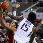 Virginia Techs Kerry Blackshear Jr. (24) has his shot blocked by Washingtons Noah Dickerson (15) during a game on Dec. 15, 2018 in Atlantic City, N.J. (AP Photo/Corey Perrine)