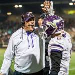 Lake Stevens head coach Tom Tri high fives Dallas Landeros on Nov. 24, during the Class 4A state state semifinal game against Woodinville at Pop Keeney Stadium in Bothell. (Olivia Vanni / The Herald)