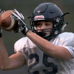 Griffin Gardoski makes a catch during practice Oct. 25, at Arlington High School. (Kevin Clark / The Herald)