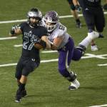 Lake Stevens Devin Kylany tries to bring down Unions Alex Vallejo after a fumble recovery in the first half of the 4A high school football championship, Dec. 1, in Tacoma. (Andy Bronson / The Herald)