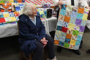 Ginny Mayer made more than 45 quilts sized for children after hearing Toys for Tots could give them away at Christmas to families in need. (Patricia Guthrie / Whidbey News Group)
