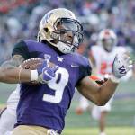 Washingtons Myles Gaskin runs on a carry during an NCAA college football game against Oregon State on Nov. 17 in Seattle. Washington won 42-23. (Elaine Thompson / AP file)