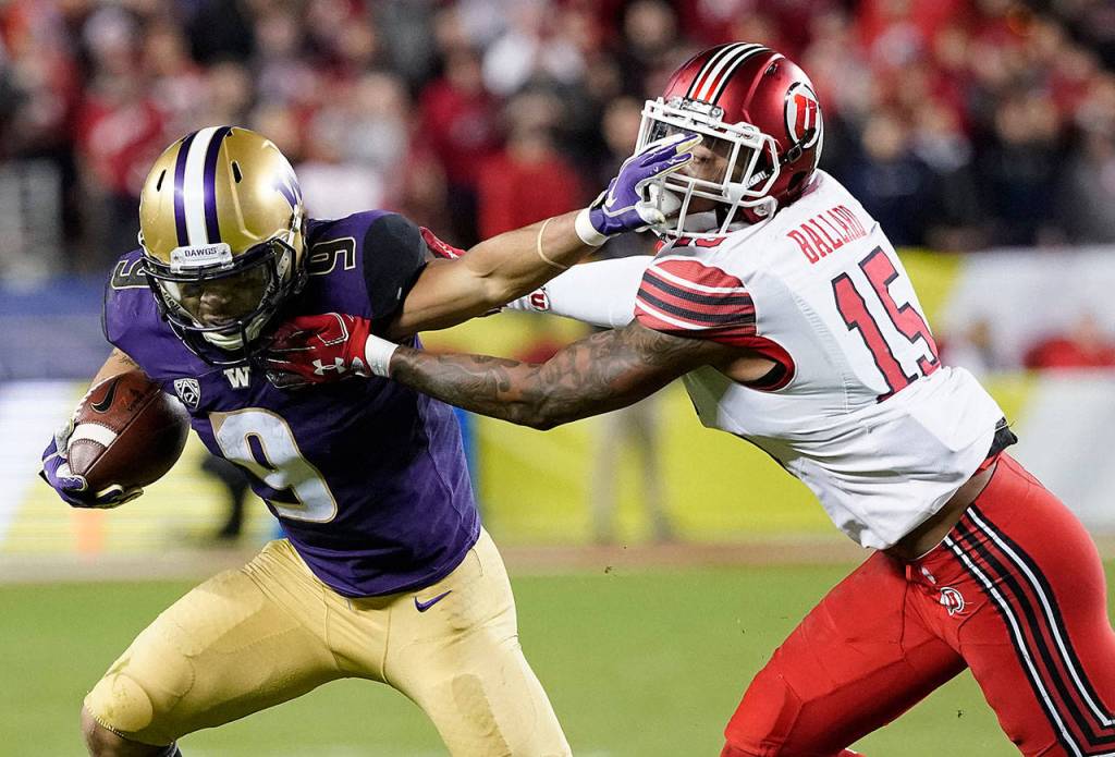 Washington running back Myles Gaskin (9) runs against Utah defensive back Corrion Ballard (15) during the first half of the Pac-12 Conference championship NCAA college football game in Santa Clara, California, on Nov. 30. (Tony Avelar / AP file)