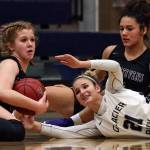 Lake Stevens Cori Wilcox gathers a loose ball with Glacier Peaks Sydney Guffey (right bottom) and Lake Stevens Baylor Thomas looking on Tuesday, Dec. 18 at Glacier Peak High School in Snohomish. Glacier Peak won 68-50. (Kevin Clark / The Herald)