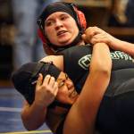 Marysville-Gethells Dori Hofmann (top) wrestles Cascades Christine Stephen on Wednesday at Mariner High School in Everett. (Kevin Clark / The Herald)