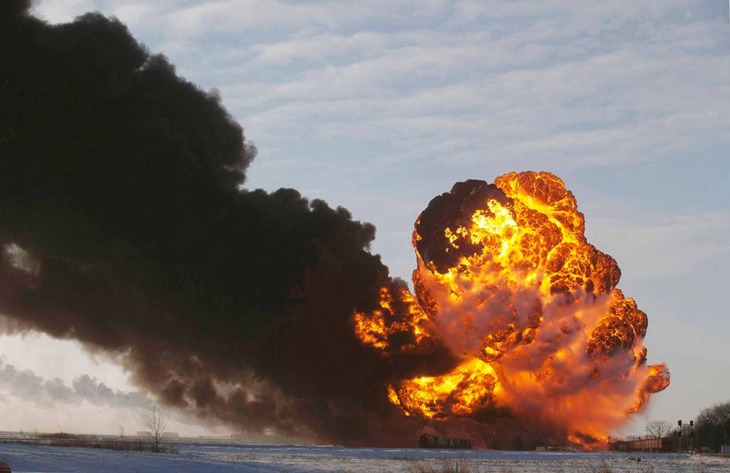 In this 2013 photo, a fireball goes up at the site of an oil train derailment near Casselton, North Dakota. (AP Photo/Bruce Crummy, File)