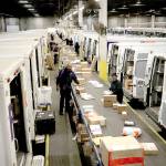 <address>                                Trucks sit with their doors wide open, waiting to be loaded at the FedEx sorting facility. (E. Jason Wambsgans/Chicago Tribune)                                </address>