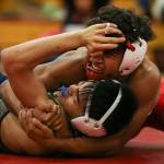 Marysville Pilchucks Isaiah Galindo (top) works to pin Everetts Christian De Guzman on Thursday night at Marysville Pilchuck High School. Galindo won by pin in the second round. (Kevin Clark / The Herald)