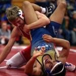 Marysville Pilchucks Austin Davis (left) wrestles Everetts Fernie Vasquez on Thursday night at Marysville Pilchuck High School. Davis won by decision. (Kevin Clark / The Herald)