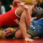 Marysville Pilchucks Ahmad Humoud (top) wrestles Everetts Riley Bennet Thursday night at Marysville Pilchuck High School. Humoud won by fall in the third round. (Kevin Clark / The Herald)