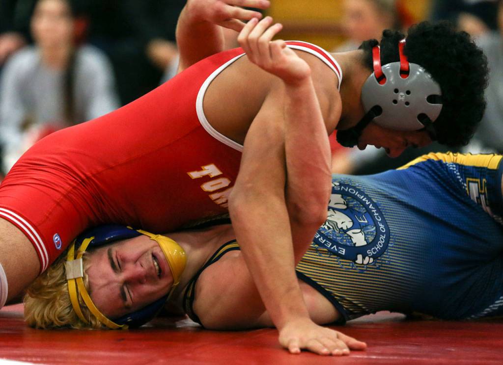 Marysville Pilchucks Ahmad Humoud (top) wrestles Everetts Riley Bennet Thursday night at Marysville Pilchuck High School. Humoud won by fall in the third round. (Kevin Clark / The Herald)